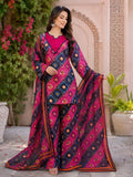 vibrant three-piece traditional South Asian outfit
