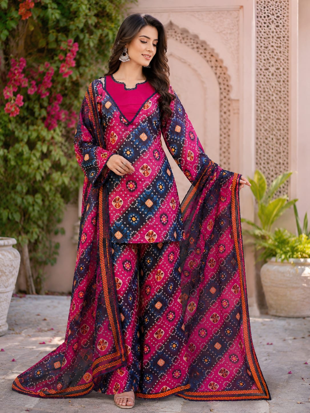 vibrant three-piece traditional South Asian outfit